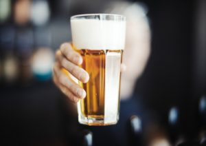 hand holding a beer
